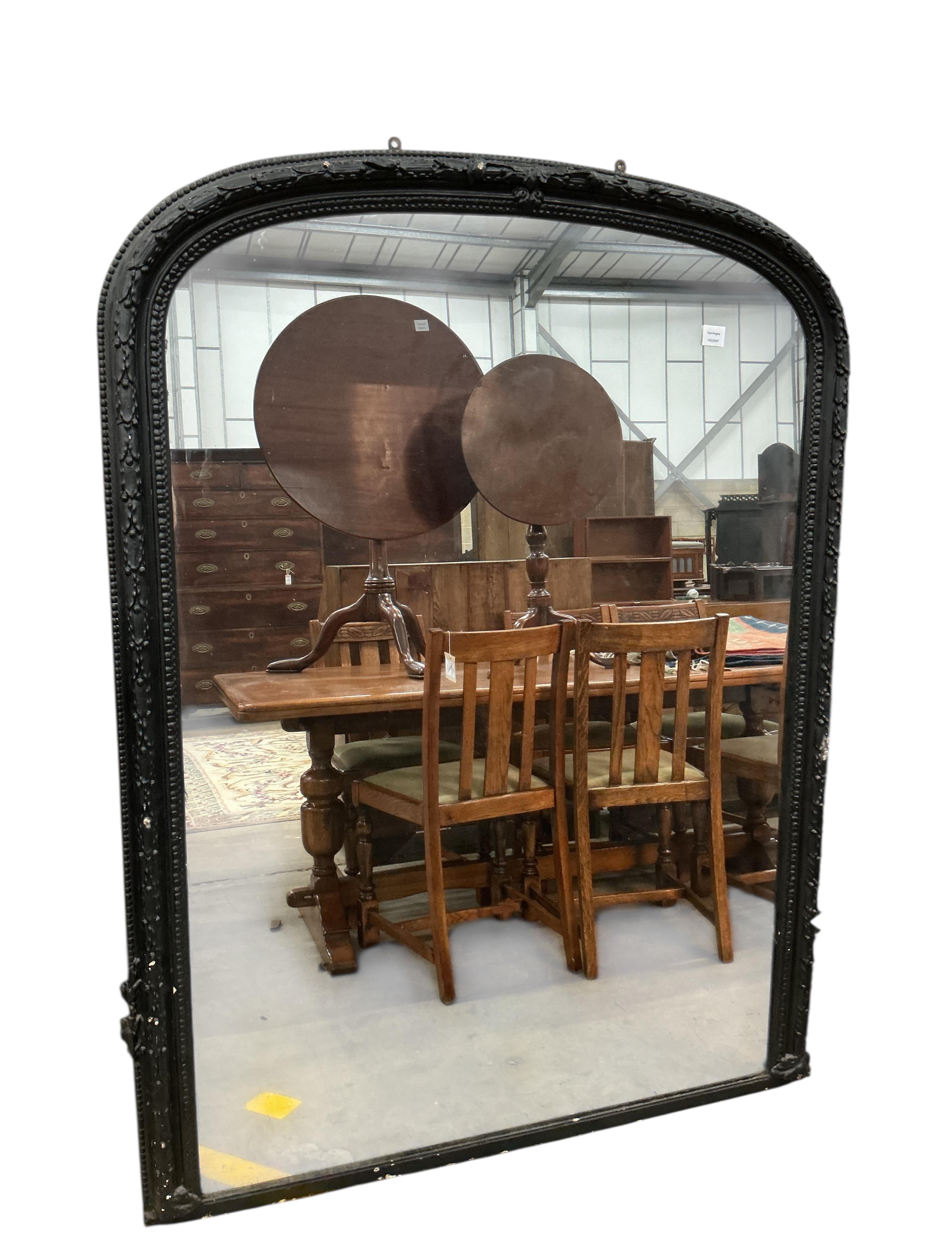 A Victorian overmantel mirror, later painted black, width 122cm, height 165cm